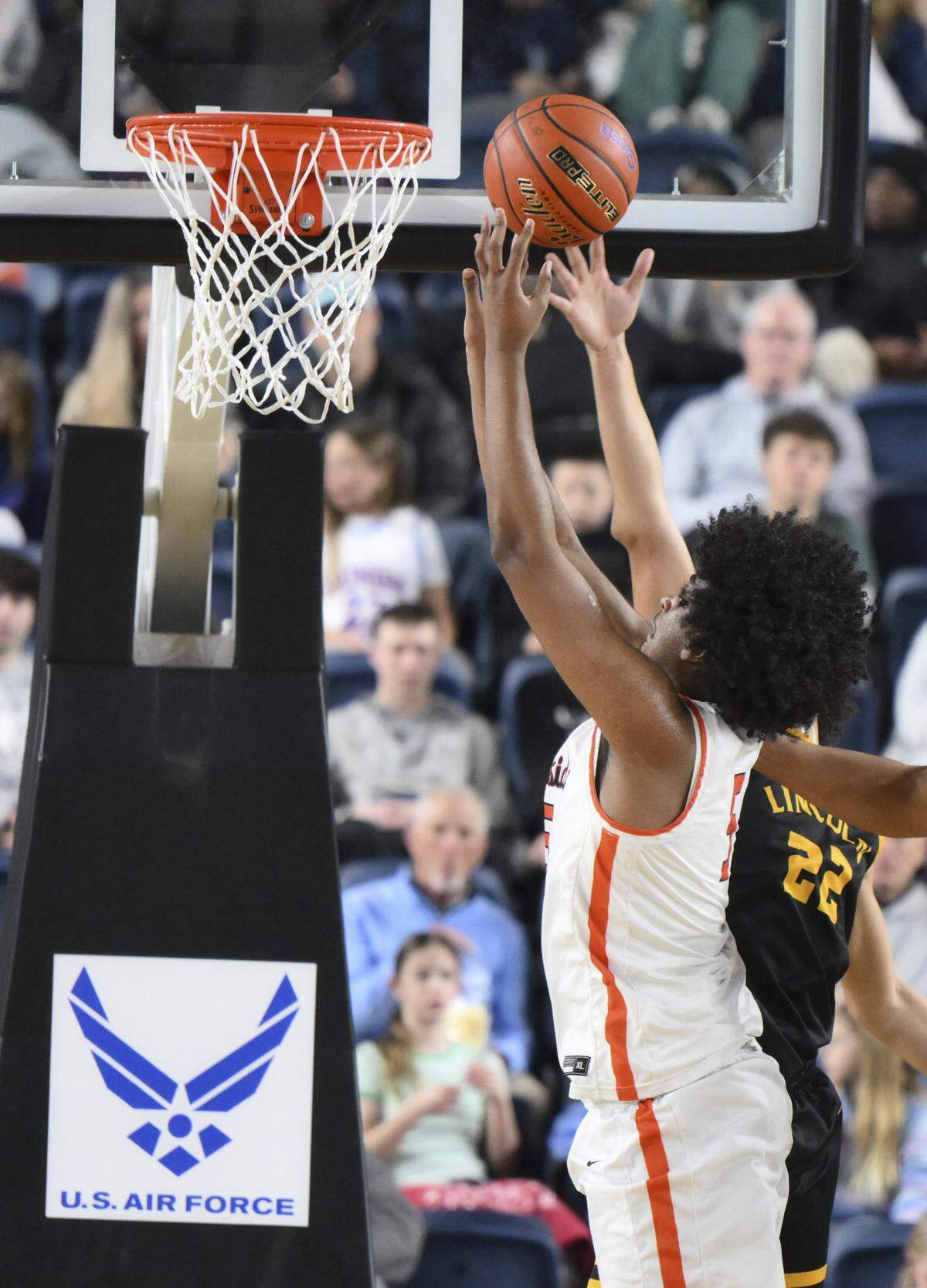 Eastside Catholic Center Yabi Aklog (5) goes to the net against Lincoln during the semifinal round of the 3A State Tournament at the Tacoma Dome, on Friday, March 6, 2026, in Tacoma, Wash.