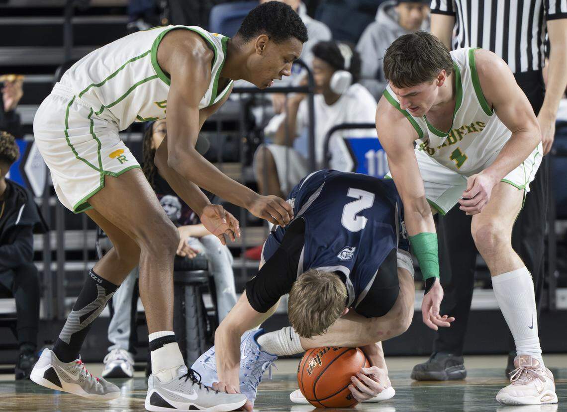 Gonzaga Prep Bullpups guard Ryan Carney (2) falls on the ball against Richland during the Boys 4A State Tournament Championship at the Tacoma Dome, on Saturday, March 7, 2026, in Tacoma, Wash.
