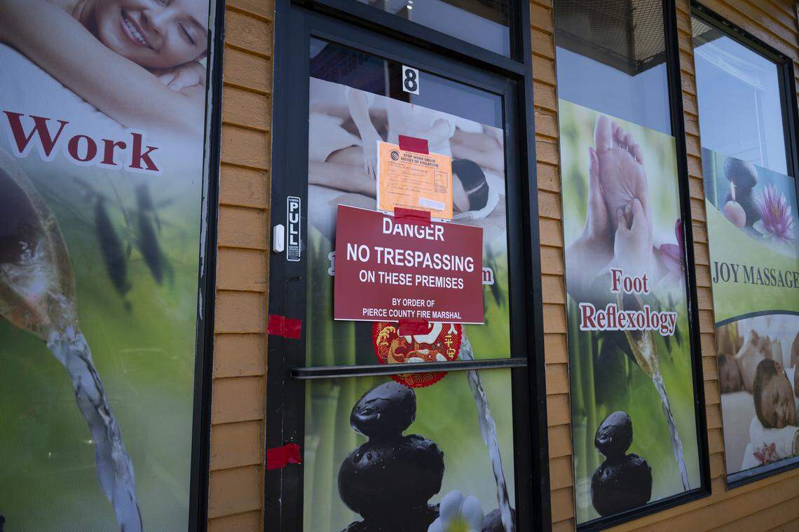 A Pierce County Fire Marshall’s “no trespassing” sign is affixed to the door of Joy Massage, on Wednesday, April 29, 2026, in Tacoma. 