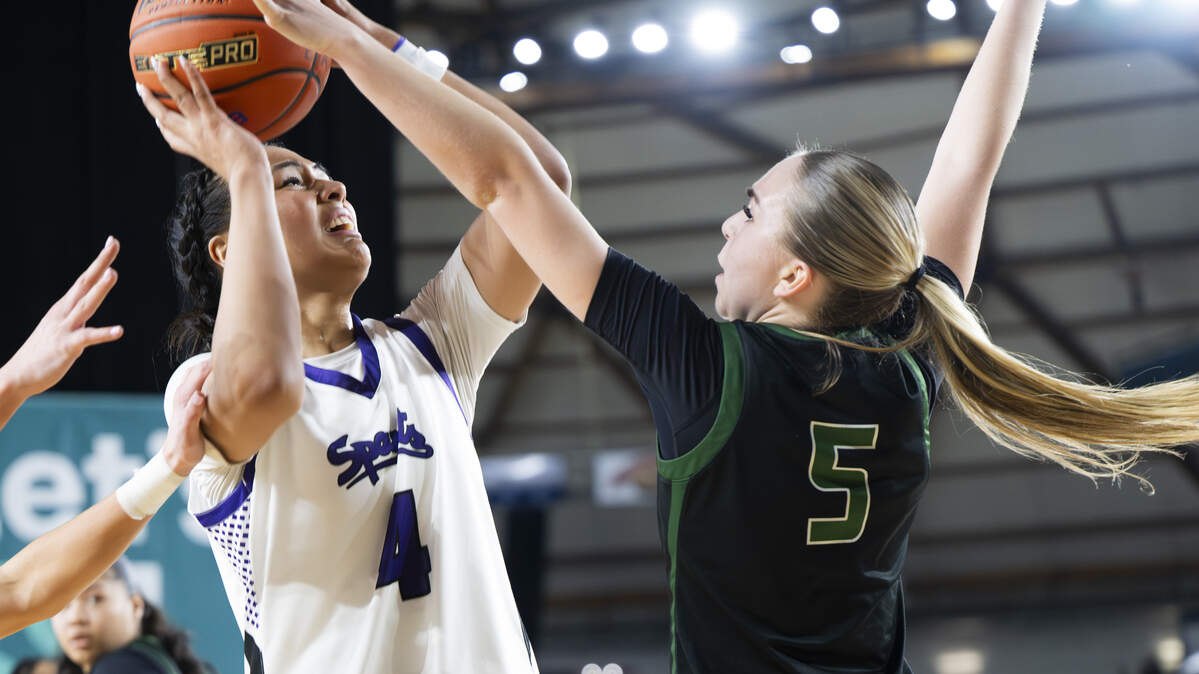 Sumner guard Kawehi Borden (4) is fouled by Auburn’s Morgan Richardson (5) during the first round of the 4A State Tournament at the Tacoma Dome, on Wednesday, March 4, 2026, in Tacoma, Wash.