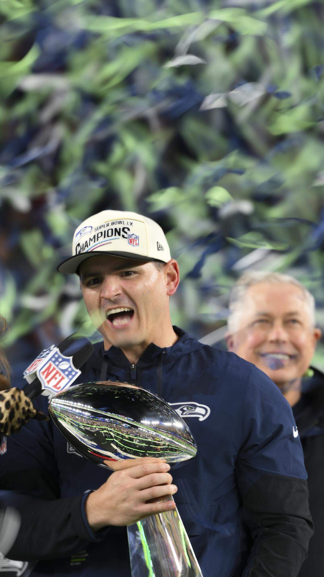 Seattle Seahawks head coach Mike MacDonald holds the Lombardi Trophy after beating the New England Patriots 29-13 in Super Bowl LX at Levi's Stadium on Sunday, Feb. 8, 2026, in Santa Clara, Calif.