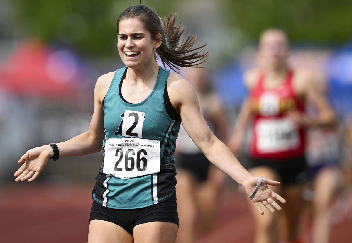 Bonney Lakes’ Latham West reacts to taking first place the pack in the girls 4A 1600m run during day one of the Track and Field Championship at Mount Tahoma High School, on Thursday, May 28, 2026, in Tacoma, Wash.