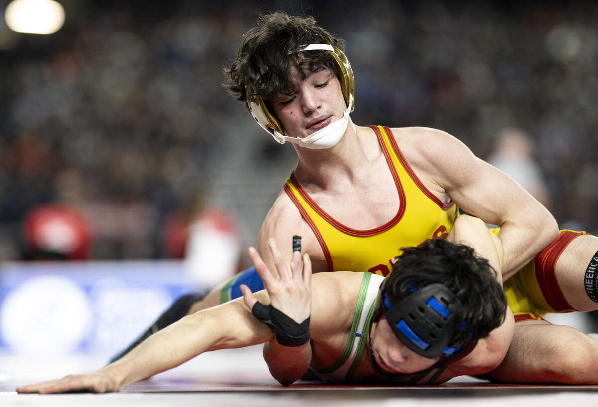 Capital’s Lazarus McEwen controls the arm of Liberty’s Jackson Mostrom in the Boys 3A 113-pound Championship match during the Mat Classic XXXVII at the Tacoma Dome, on Friday, Feb. 20, 2026, in Tacoma, Wash.