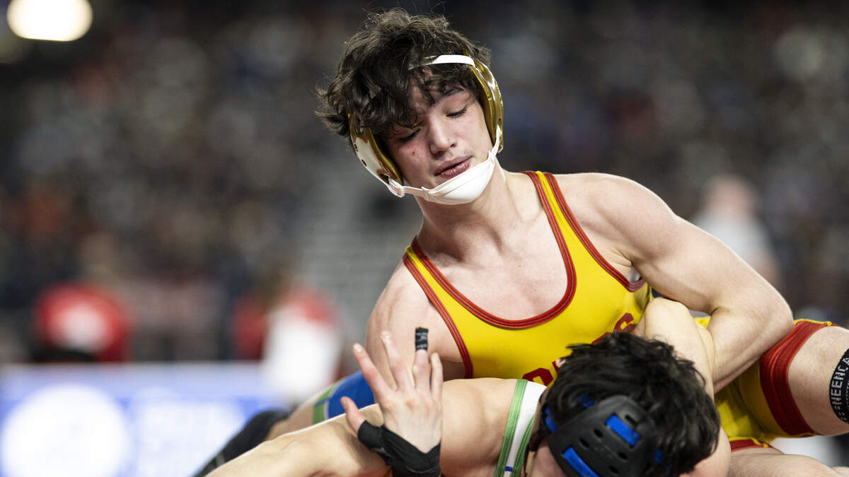 Capital’s Lazarus McEwen controls the arm of Liberty’s Jackson Mostrom in the Boys 3A 113-pound Championship match during the Mat Classic XXXVII at the Tacoma Dome, on Friday, Feb. 20, 2026, in Tacoma, Wash.