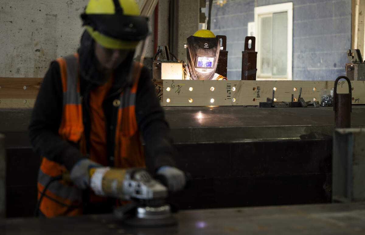 Workers sand and weld pieces at Concrete Technology Corporation, on Monday, July 13, 2026, in Tacoma.