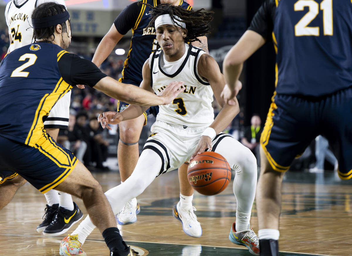 Lincoln guard Davion Shareef-Dulanacy (3) dribbles between Bellevue defenders during the quarterfinal round of the 3A State Tournament at the Tacoma Dome, on Thursday, March 5, 2026, in Tacoma, Wash.