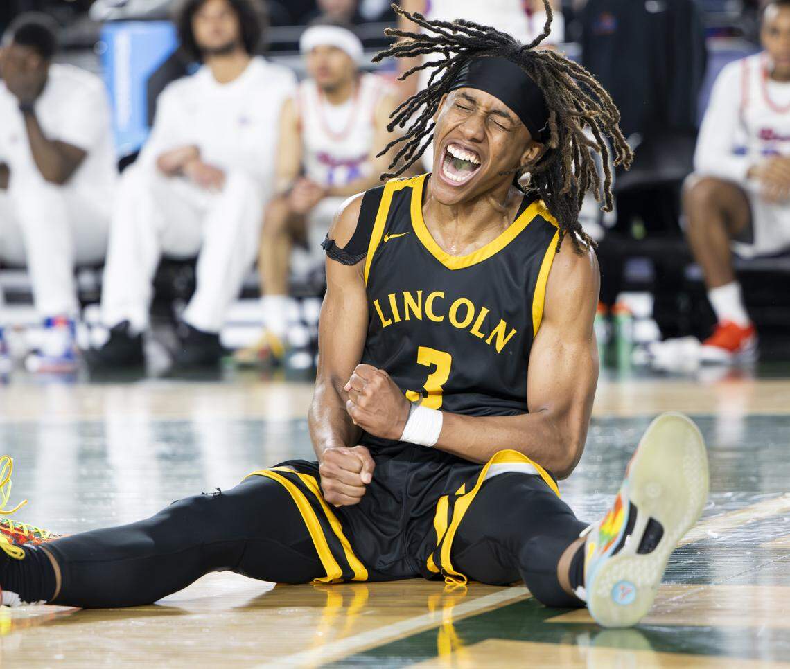 Lincoln guard Davion Shareef-Dulanacy (3) reacts to and and-one against Rainier Beach during the Boys 3A State Tournament Championship at the Tacoma Dome, on Saturday, March 7, 2026, in Tacoma, Wash.