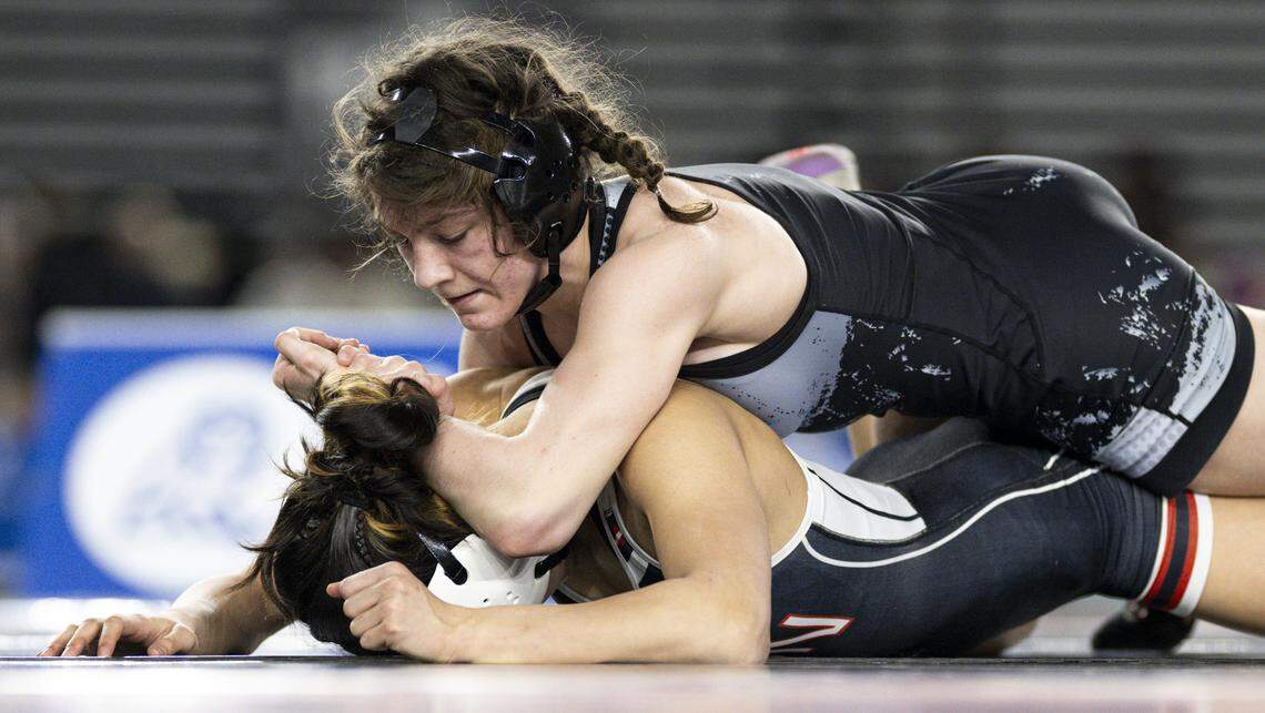 Bonney Lake’s Winter West controls Union’s Kiana Kilauea in the Girls 4A 120-pound Championship match during the Mat Classic XXXVII at the Tacoma Dome, on Friday, Feb. 20, 2026, in Tacoma, Wash.