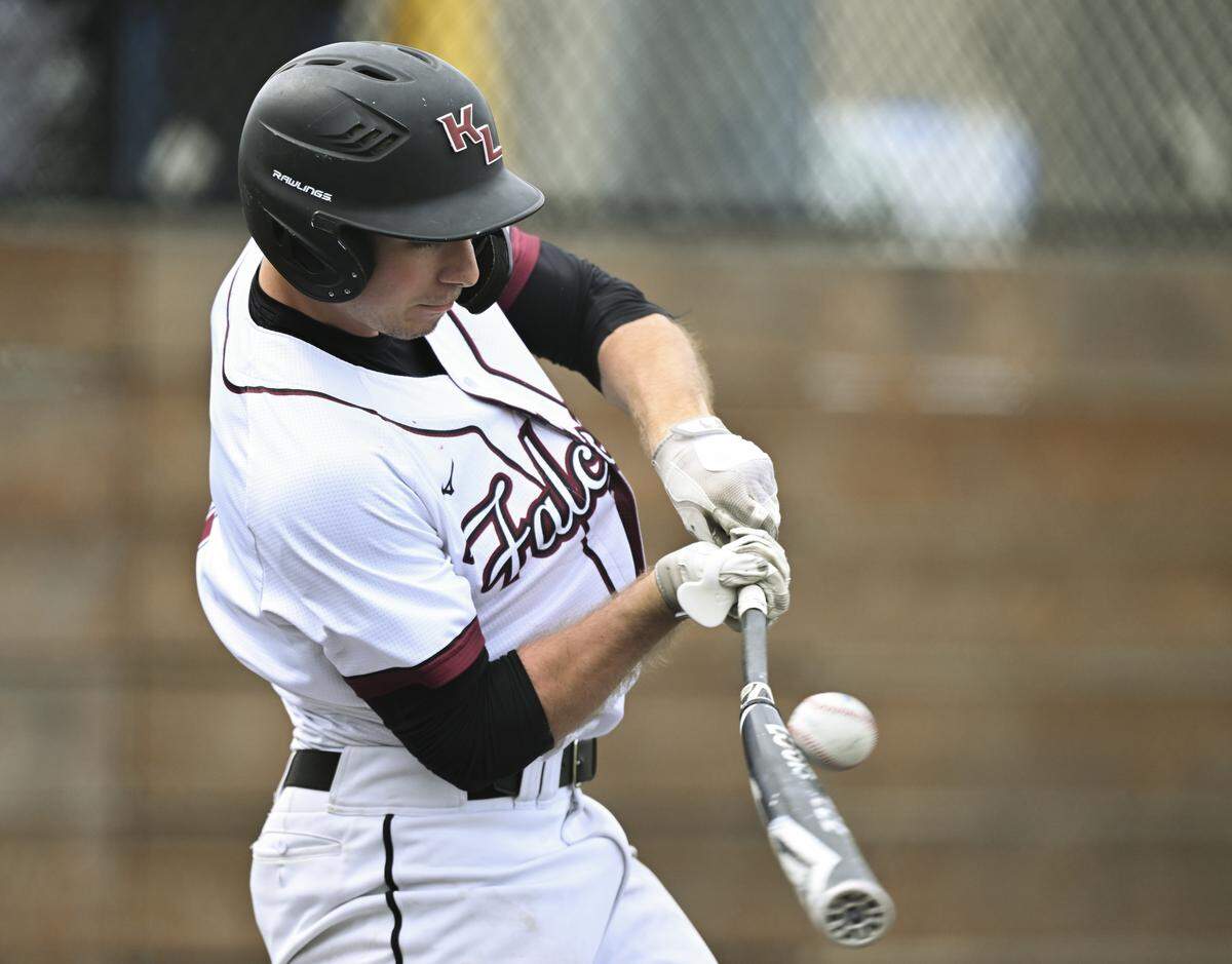 Kentlake's Christopher Moore (1) make contact with the ball from Gig Harbor's Daniel Sleeter (2) during the 3A District 3 baseball championship at Auburn High School, on Saturday, May 16, 2026, in Auburn, Wash.