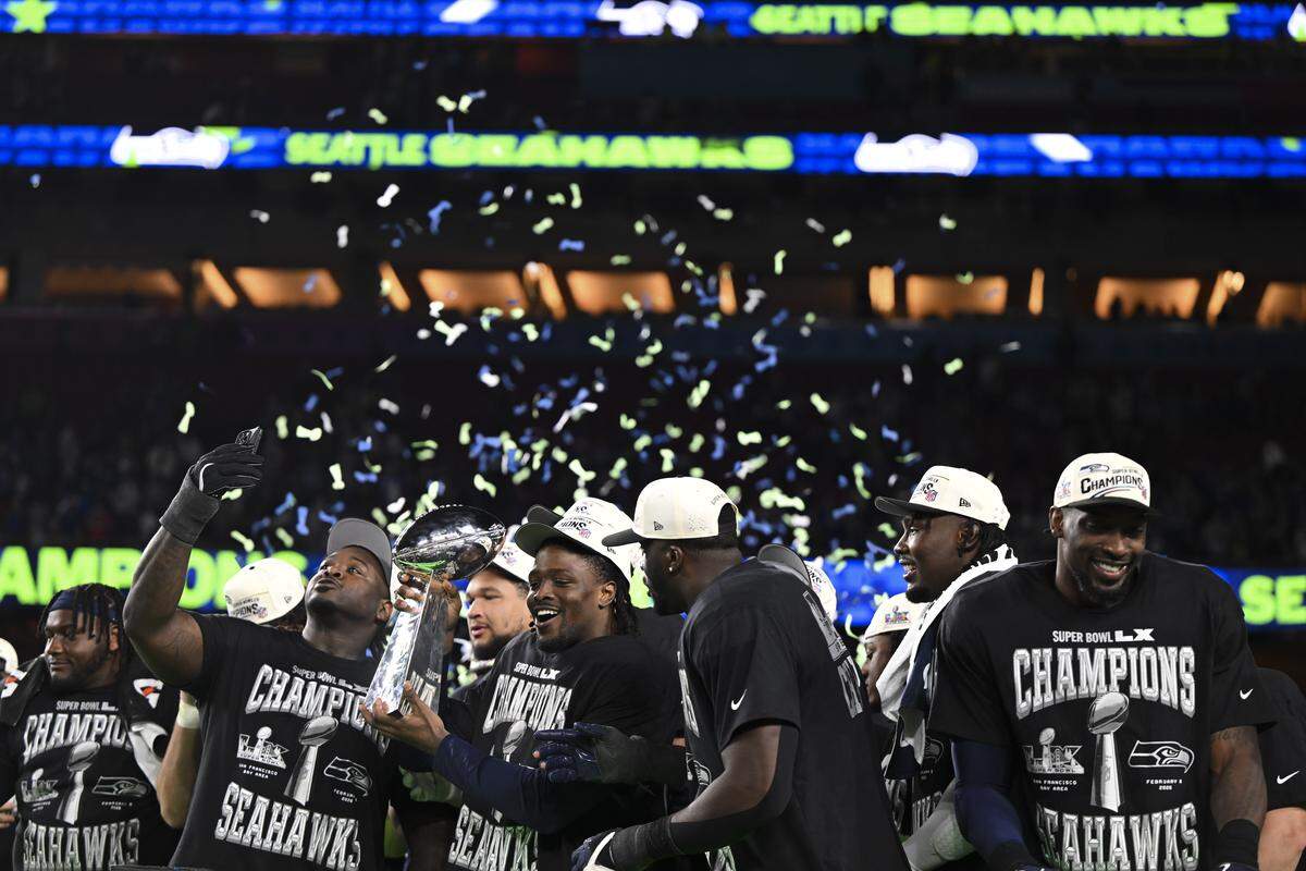The Seattle Seahawks hoist the Lombardy Trophy after beating the New England Patriots 29-13 in Super Bowl LX at Levi's Stadium on Sunday, Feb. 8, 2026, in Santa Clara, Calif.