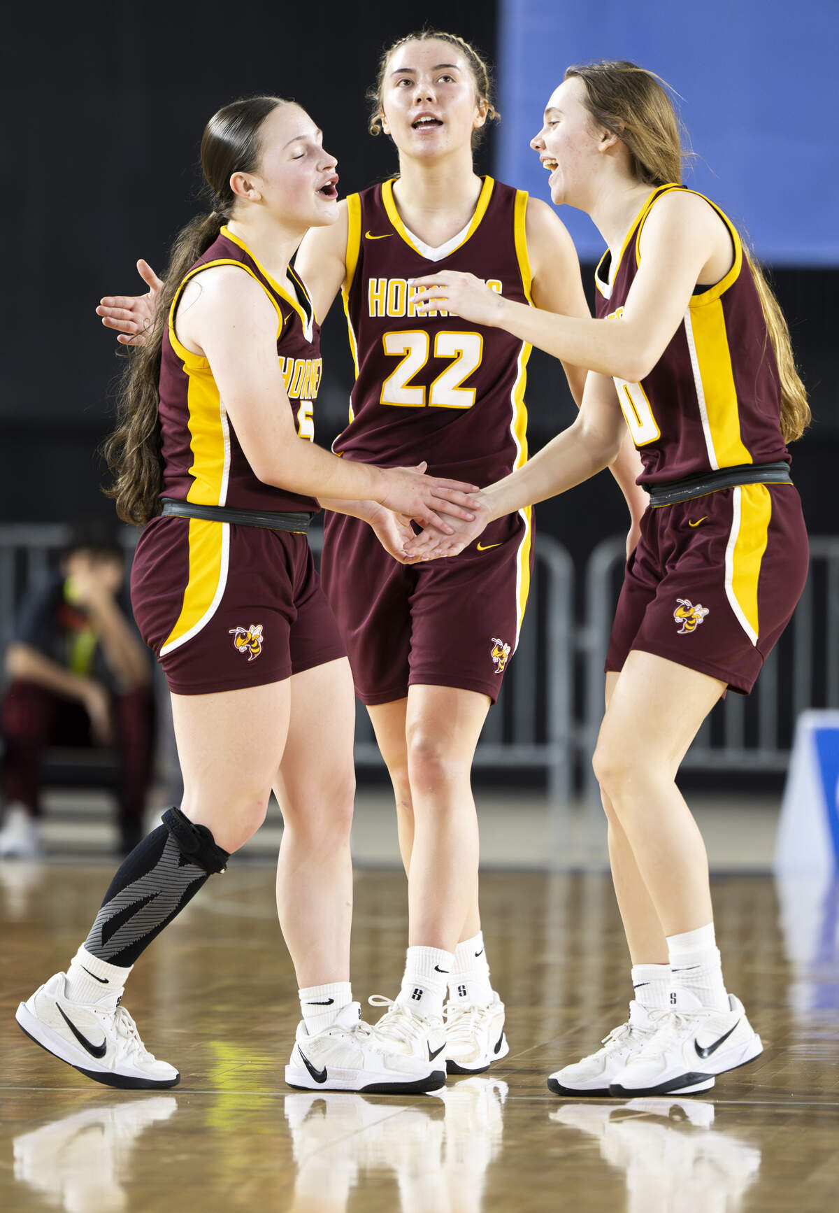 White River Lilly Banks (5), Maggee Schmitz (22) and Kaitlyn Hewlett (10) react to a travel against North Thurston during the first round of the 3A State Tournament at the Tacoma Dome, on Wednesday, March 4, 2026, in Tacoma, Wash.