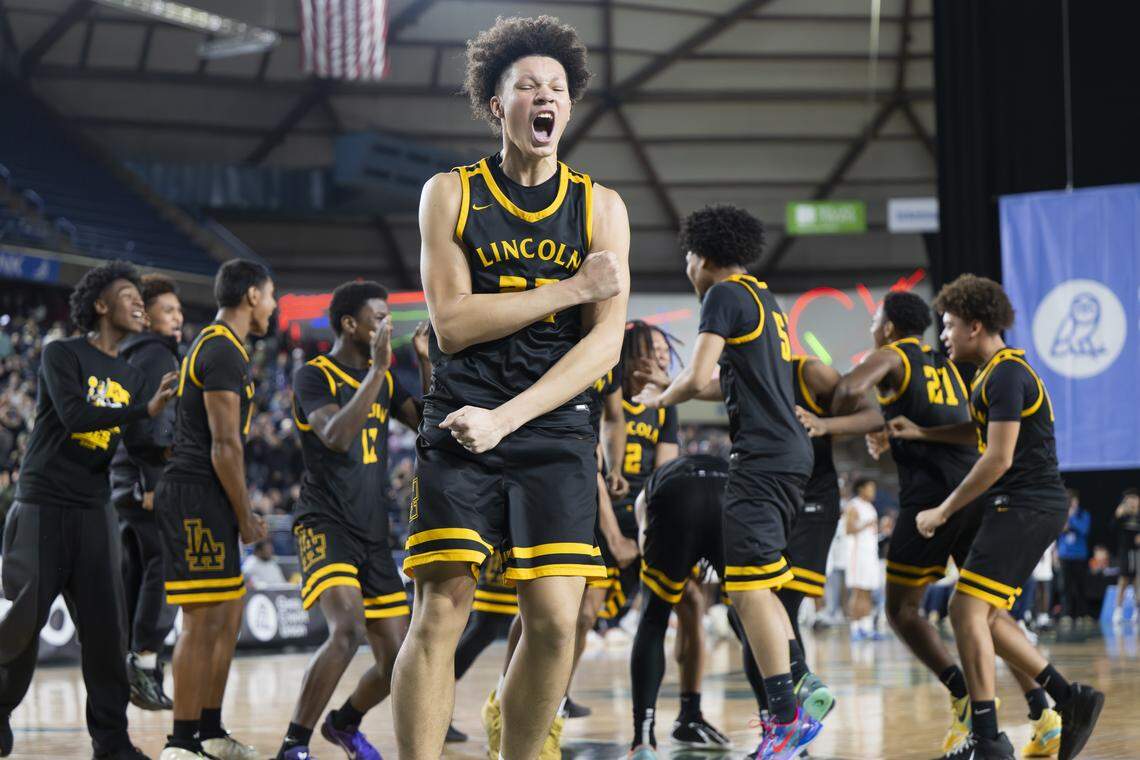 Lincoln forward Justus Holt (22) reacts to beating Eastside Catholic during the semifinal round of the 3A State Tournament at the Tacoma Dome, on Friday, March 6, 2026, in Tacoma, Wash.