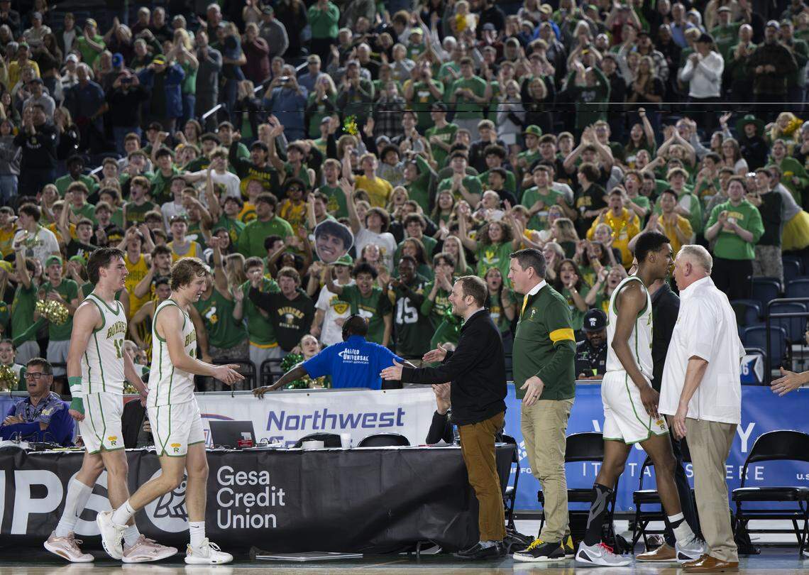 Richland guard Landen Northrop (12) and guard Jackson Woodard (22) come off the court in the closing second of their victory over Lake Washington in the semifinal round of the 4A State Tournament at the Tacoma Dome, on Friday, March 6, 2026, in Tacoma, Wash.