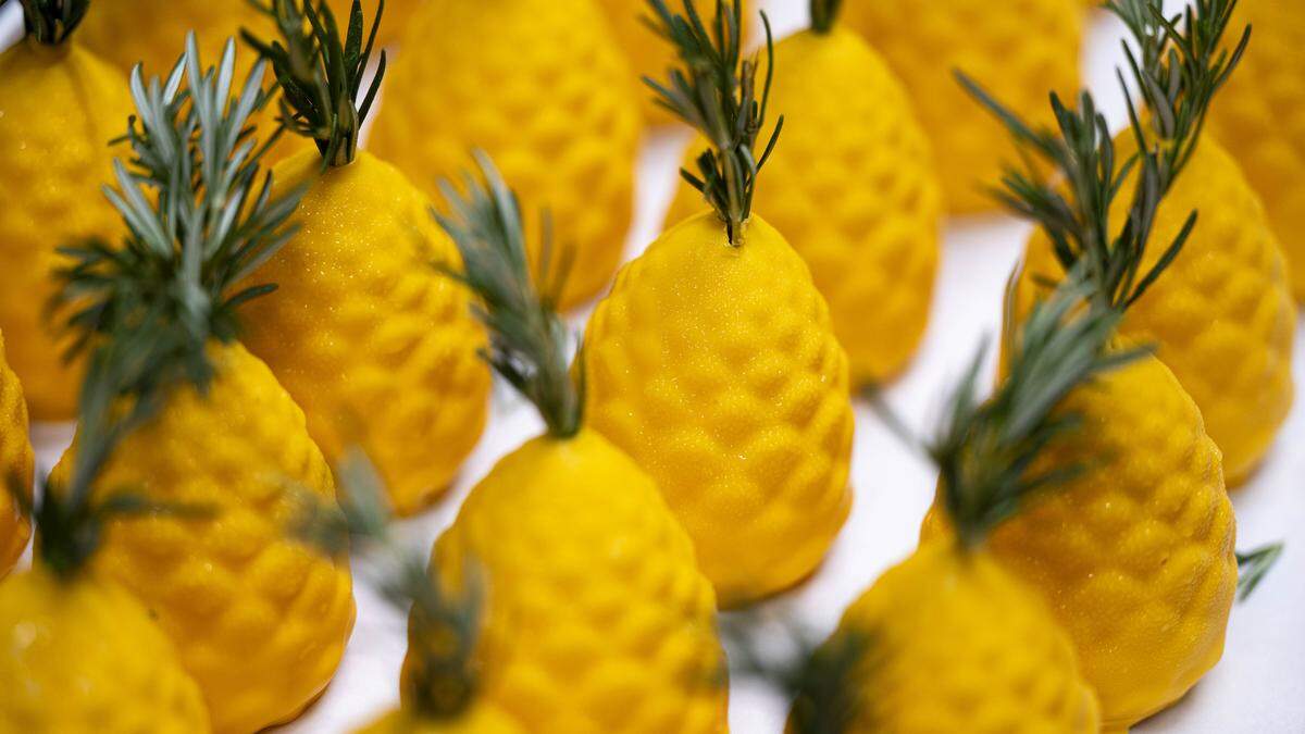 The multi-day process begins with mousse and compote that’s frozen in molds overnight, then dipped in tempered chocolate and cocoa butter and garnished. The pineapple is lightly caramelized for additional flavor.