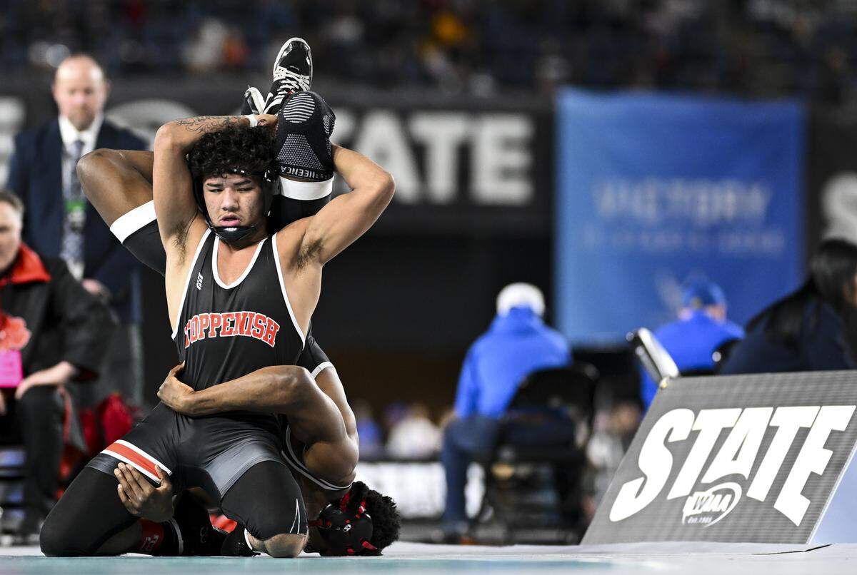 Toppenish’s Justice Zuniga attempt to takedown Orting’s Dominic Thomas in the Boys 2A 138-pound Championship match during the Mat Classic XXXVII at the Tacoma Dome, on Saturday, Feb. 21, 2026, in Tacoma, Wash.