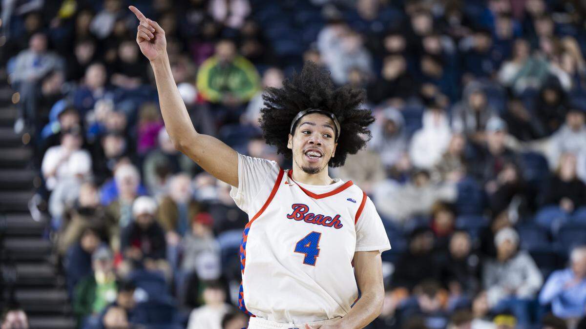 Rainier Beach wing Tyran Stokes (4) reacts to a three point basket against Bellarmine Prep during the semifinal round of the 3A State Tournament at the Tacoma Dome, on Friday, March 6, 2026, in Tacoma, Wash.