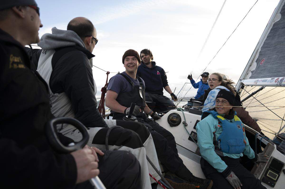The crew of Grace E shares a laugh after The Corinthian Yacht Club of Tacoma Late Spring Windseekers #1 race on Commencement Bay, on Wednesday, May 13, 2026, in Tacoma.