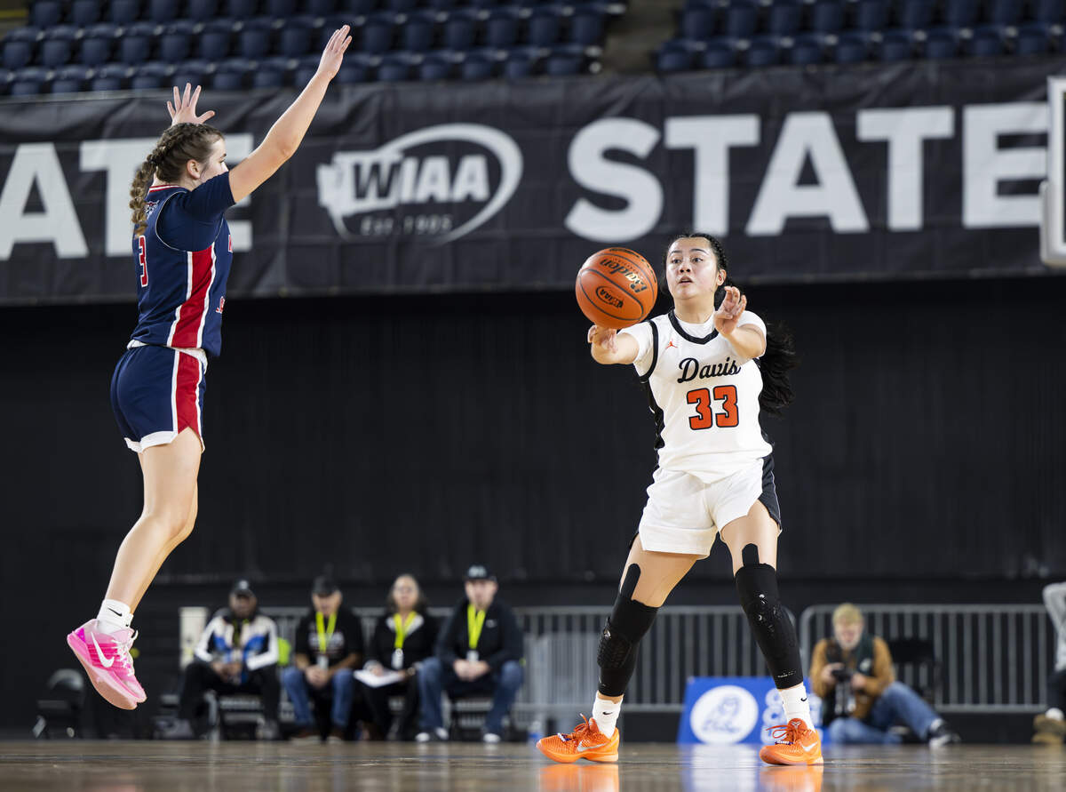 Davis Pirates guard Isa Garcia (33) passes the ball against Kennedy Catholic during the semifinal round of the 4A State Tournament at the Tacoma Dome, on Friday, March 6, 2026, in Tacoma, Wash.