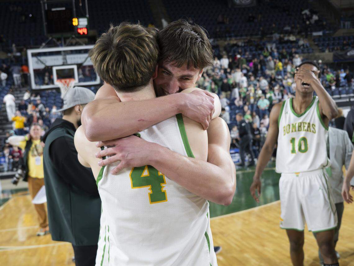 Richland guard Braylon Edwards (4) and Richland guard Landen Northrop (1) react to winning the Boys 4A State Tournament Championship Gonzaga Prep at the Tacoma Dome.