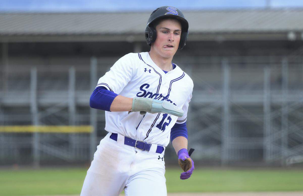 Sumner’s Jake Miller (12) runs to third base during the game against Emerald Ridge at Sumner High School, on Tuesday, April 21, 2026, in Sumner, Wash.