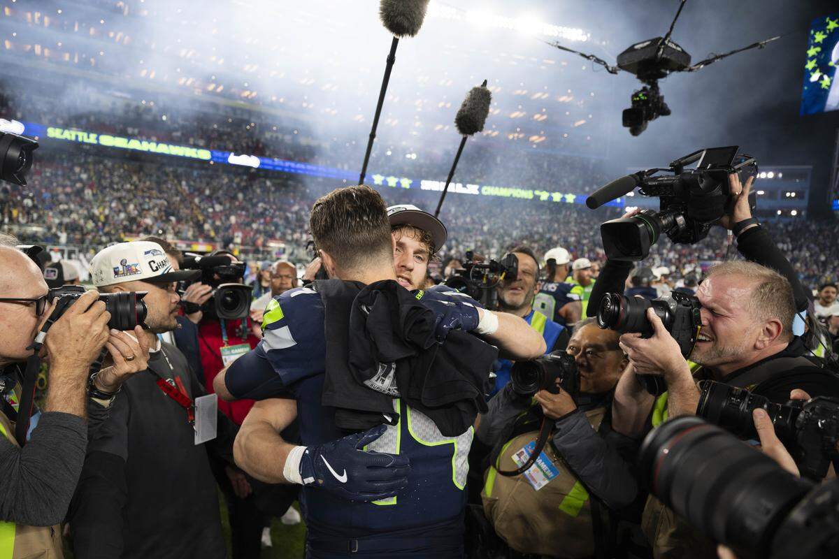 Seattle Seahawks wide receiver Cooper Kupp (10) and quarterback Sam Darnold (14) after beating the New England Patriots 29-13 in Super Bowl LX at Levi's Stadium on Sunday, Feb. 8, 2026, in Santa Clara, Calif.
